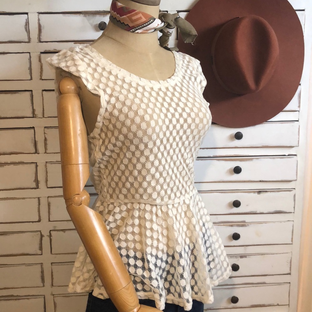 Lace peplum short cap sleeved top.